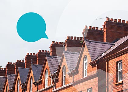 Speech bubble floating above row of red brick houses