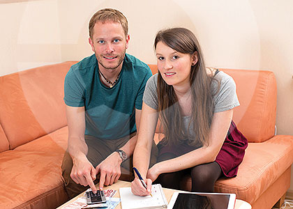 Young couple completing a household budget survey